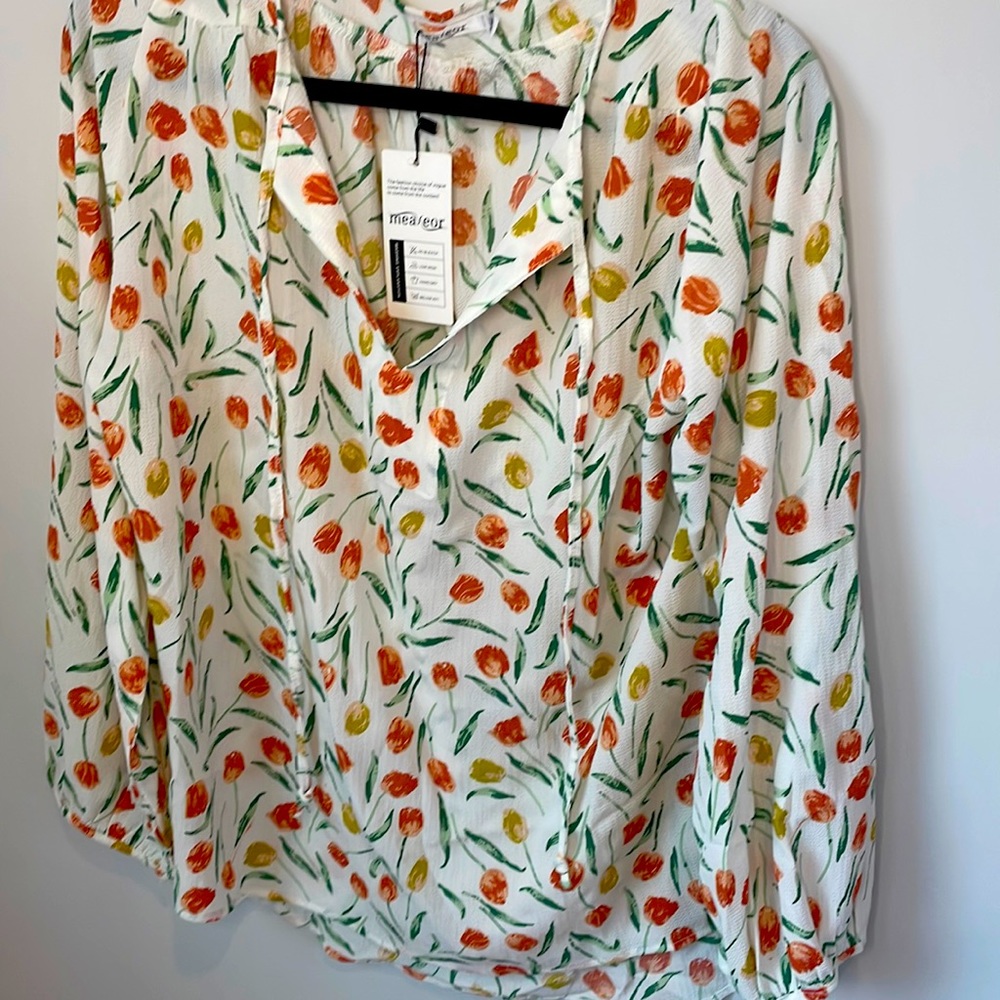 New extra extra large- XXL top.  light airy material.  Wear it for any season